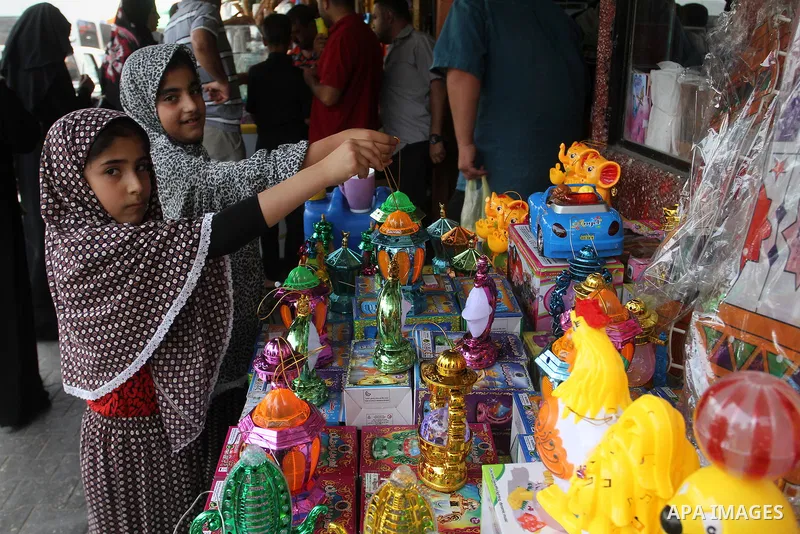 Palestinians shop at a traditional market in preparation for the holy month of Ramadan in Rafah in the southern Gaza strip on June 4,2016. Muslims around the world refrain from eating, drinking and sexual intercourse fro...