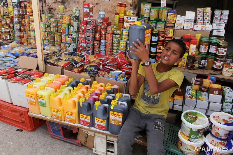 Palestinians shop at a traditional market in preparation for the holy month of Ramadan in Rafah in the southern Gaza strip on June 4,2016. Muslims around the world refrain from eating, drinking and sexual intercourse fro...