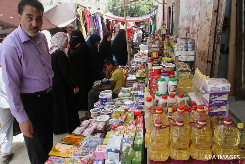 Palestinians shop at a traditional market in preparation for the holy month of Ramadan in Rafah in the southern Gaza strip on June 4,2016. Muslims around the world refrain from eating, drinking and sexual intercourse fro...