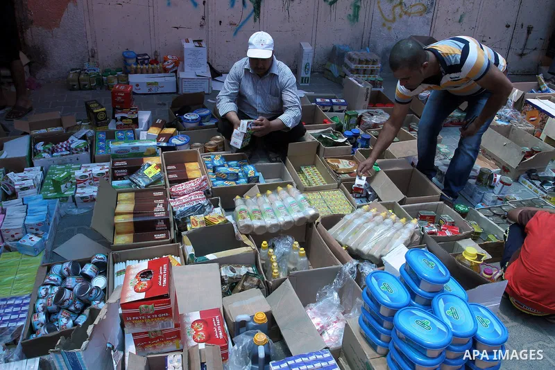 Palestinians shop at a traditional market in preparation for the holy month of Ramadan in Rafah in the southern Gaza strip on June 4,2016. Muslims around the world refrain from eating, drinking and sexual intercourse fro...