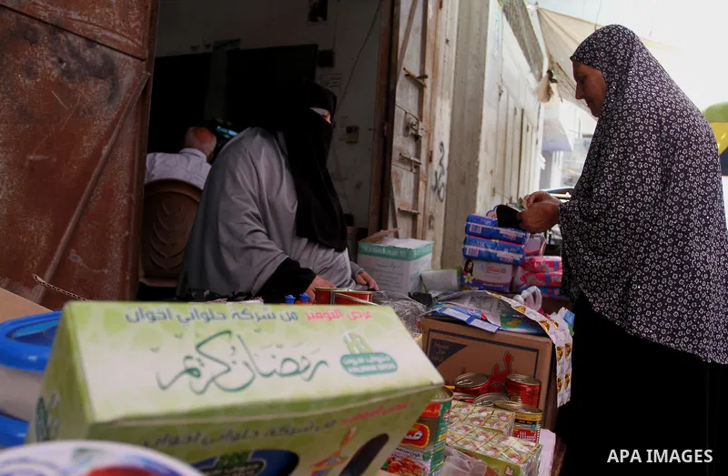 Palestinians shop at a traditional market in preparation for the holy month of Ramadan in Rafah in the southern Gaza strip on June 4,2016. Muslims around the world refrain from eating, drinking and sexual intercourse fro...