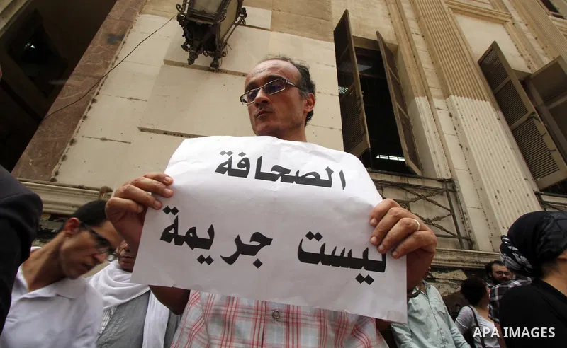 Egyptian Journalists and activists chant slogans and hold banners during a protest in front of the Journalists' Syndicate in Cairo, Egypt, on June 4, 2016. Photo by Amr Sayed