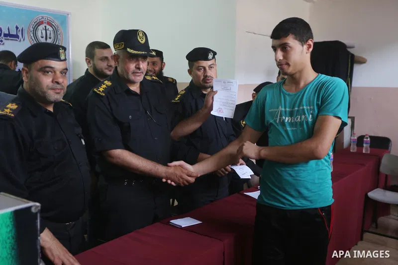 Pamestinian Members of the Ministry of Interior, attend to announce the names of prisoners, in Gaza City on June 5, 2016. Security officials in Gaza Strip said on Sunday they released 156 prisoners occasion of the Muslim...