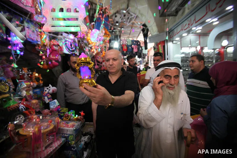 A Palestinian vendor displays traditional lanterns known in Arabic as "Fanous" sold during the Muslim holy month of Ramadan at a market in the west bank city of Nablus , on June 5, 2016 as the faithful prepare to start f...