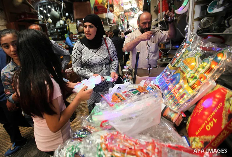 A Palestinian vendor displays traditional lanterns known in Arabic as "Fanous" sold during the Muslim holy month of Ramadan at a market in the west bank city of Nablus , on June 5, 2016 as the faithful prepare to start f...