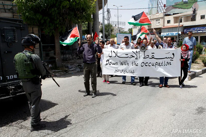 Palestinians take part in a demonstration to mark Naksa Day (setback), in the West Bank city of Hebron, on June 04, 2016. Palestinians mark "Naksa Day" to mourn the 49th anniversary of Israel's occupation of the West Ban...
