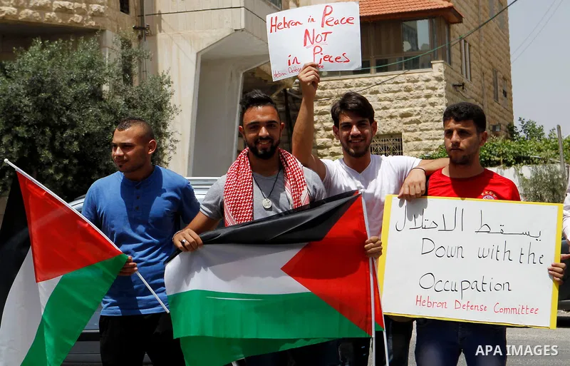 Palestinians take part in a demonstration to mark Naksa Day (setback), in the West Bank city of Hebron, on June 04, 2016. Palestinians mark "Naksa Day" to mourn the 49th anniversary of Israel's occupation of the West Ban...