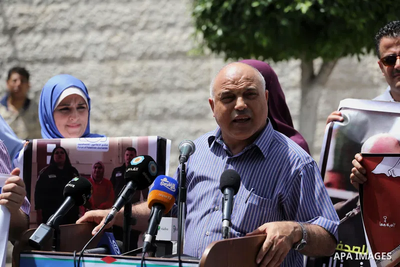 Palestinian journalists take part in a protest demanding release the journalists prisoners in Israeli jails, in front of the high commissioner for human rights headquarters in Gaza City, on June 5, 2016. Photo by Mohamme...