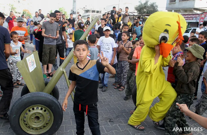 Palestinian children take part in a street celebration ahead of the beginning of the Muslim holy month of Ramadan in Rafah in the southern Gaza strip on June 5, 2016. More than 1.5 billion Muslims around the world will s...