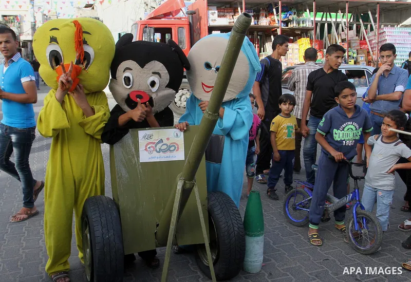 Palestinian children take part in a street celebration ahead of the beginning of the Muslim holy month of Ramadan in Rafah in the southern Gaza strip on June 5, 2016. More than 1.5 billion Muslims around the world will s...