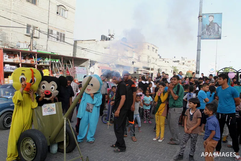 Palestinian children take part in a street celebration ahead of the beginning of the Muslim holy month of Ramadan in Rafah in the southern Gaza strip on June 5, 2016. More than 1.5 billion Muslims around the world will s...