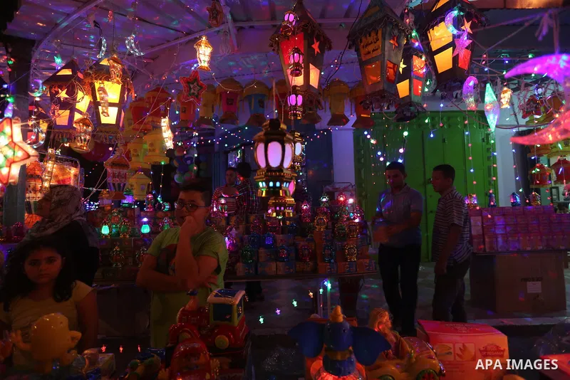A Palestinian vendor displays traditional lanterns known in Arabic as "Fanous" sold during the Muslim holy month of Ramadan at a market in Gaza city, on June 5, 2016 as the faithful prepare to start fasting. More than 1....