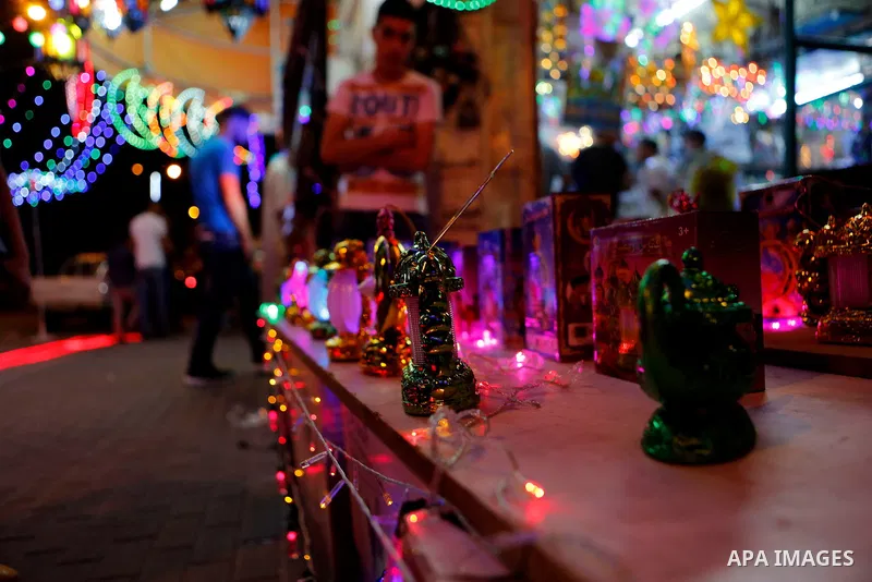 A Palestinian vendor displays traditional lanterns known in Arabic as "Fanous" sold during the Muslim holy month of Ramadan at a market in the West bank city of Hebron, on June 05, 2016. More than 1.5 billion Muslims aro...