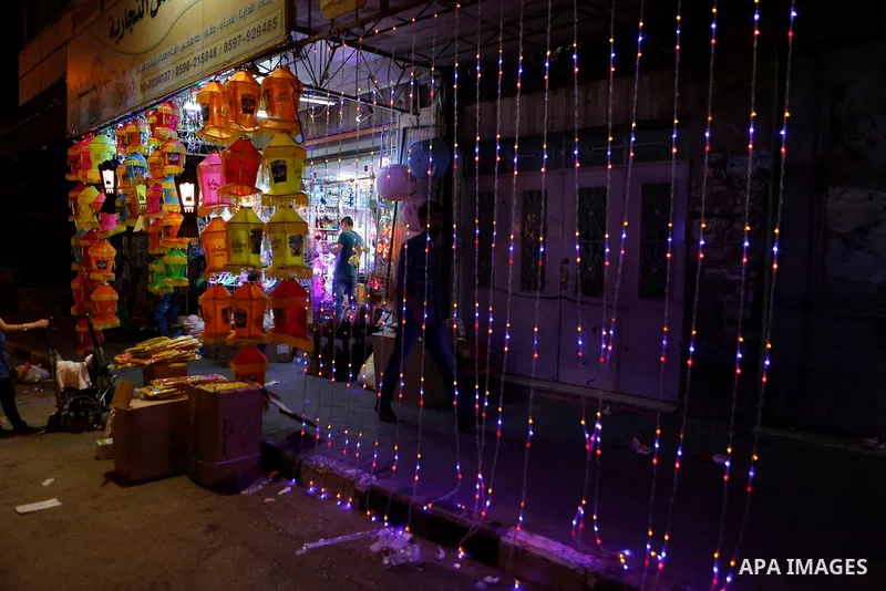 A Palestinian vendor displays traditional lanterns known in Arabic as "Fanous" sold during the Muslim holy month of Ramadan at a market in the West bank city of Hebron, on June 05, 2016. More than 1.5 billion Muslims aro...