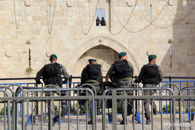 Israeli security forces stand guard during an annual march marking Israel's 1967 seizure of the Palestinian-dominated eastern half of Jerusalem, outside Damascus Gate in Jerusalem's old city on June 5, 2016. Israel occup...