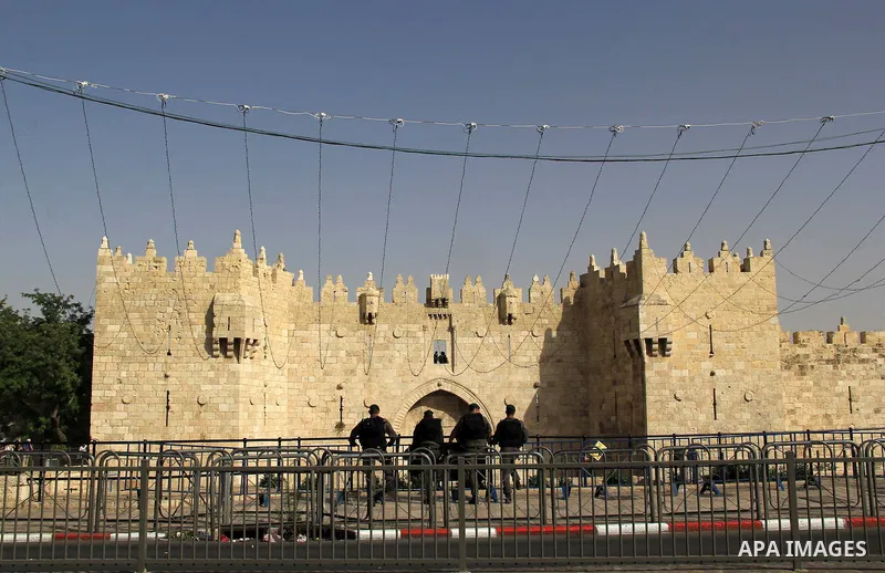 Israeli security forces stand guard during an annual march marking Israel's 1967 seizure of the Palestinian-dominated eastern half of Jerusalem, outside Damascus Gate in Jerusalem's old city on June 5, 2016. Israel occup...