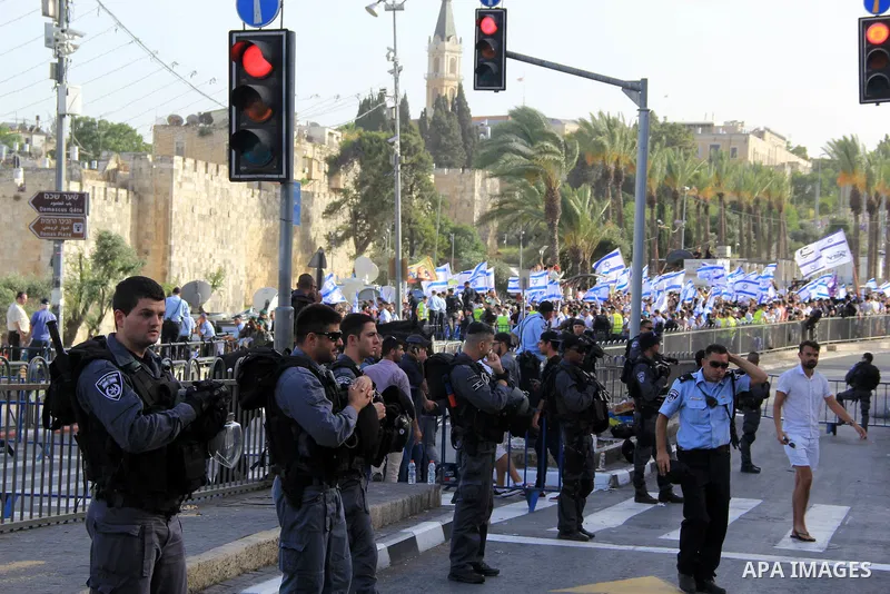 Israeli security forces stand guard during an annual march marking Israel's 1967 seizure of the Palestinian-dominated eastern half of Jerusalem, outside Damascus Gate in Jerusalem's old city on June 5, 2016. Israel occup...