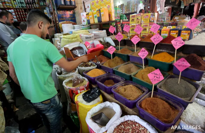 Palestinians shop at a market on the first day of the Ramadan, in Gaza city, on June 6, 2016 as the faithful prepare to start fasting. More than 1.5 billion Muslims around the world will start to celebrate Ramadan the fi...