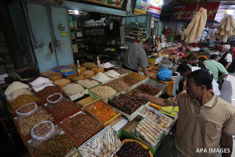 Palestinians shop at a market on the first day of the Ramadan, in Gaza city, on June 6, 2016 as the faithful prepare to start fasting. More than 1.5 billion Muslims around the world will start to celebrate Ramadan the fi...