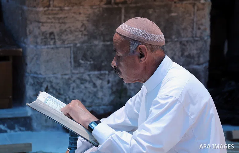 A Palestinian Muslim reads the holy Koran, Islam's holy book, in the Omari Mosque in Gaza City on June 6, 2016, on the first day of the holy month of Ramadan. Muslims around the world refrain from eating, drinking and se...