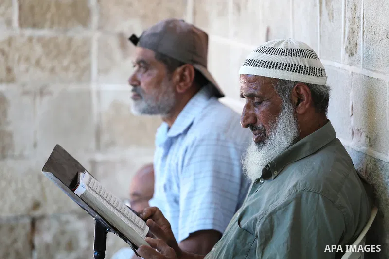 A Palestinian Muslim reads the holy Koran, Islam's holy book, in the Omari Mosque in Gaza City on June 6, 2016, on the first day of the holy month of Ramadan. Muslims around the world refrain from eating, drinking and se...