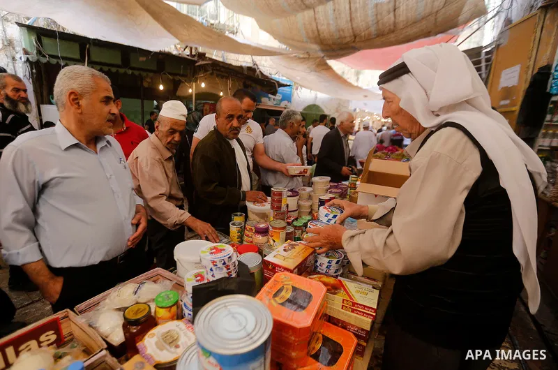 Palestinians shop at a market on the first day of the Ramadan, in the Old City of the West Bank town of Hebron, on June 6, 2016 as the faithful prepare to start fasting month of Ramadan. More than 1.5 billion Muslims aro...