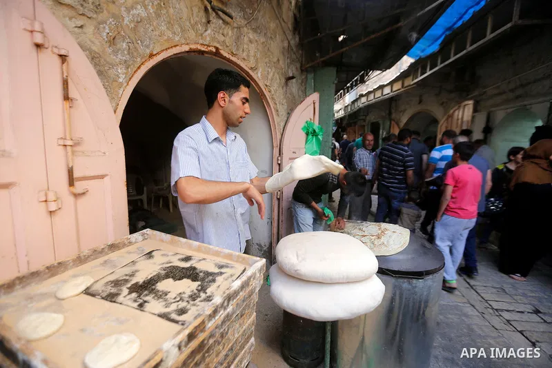 Palestinians shop at a market on the first day of the Ramadan, in the Old City of the West Bank town of Hebron, on June 6, 2016 as the faithful prepare to start fasting month of Ramadan. More than 1.5 billion Muslims aro...