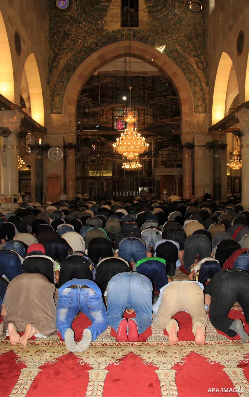 Palestinians Muslims pray at al-Aqsa mosque, in Jerusalem's old city on June 6, 2016 on the first day of the Ramadan. More than 1.5 billion Muslims around the world will start to celebrate Ramadan the first week of June,...