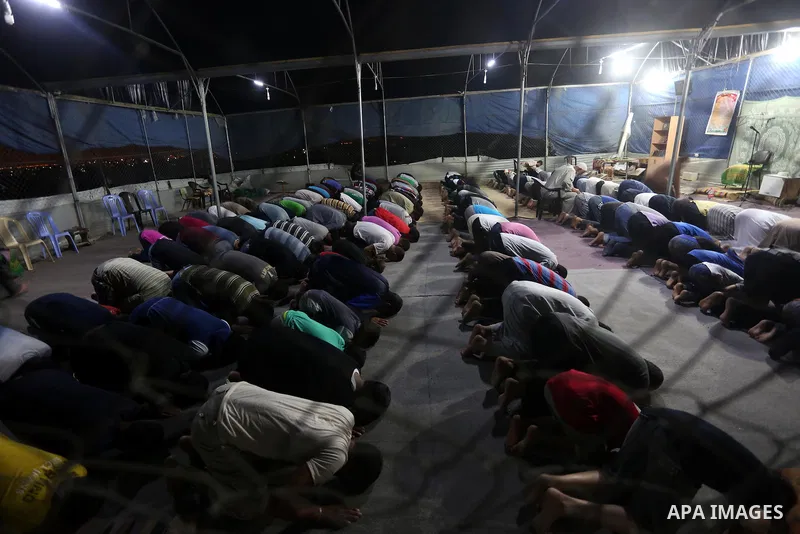 Palestinian Muslim worshipers perform "Taraweeh", nightly prayer of the month of Ramadan, at al-Muntar mosque which was destroyed during the 50-day war between Israel and Hamas militants in the summer of 2014, in Shajaiy...