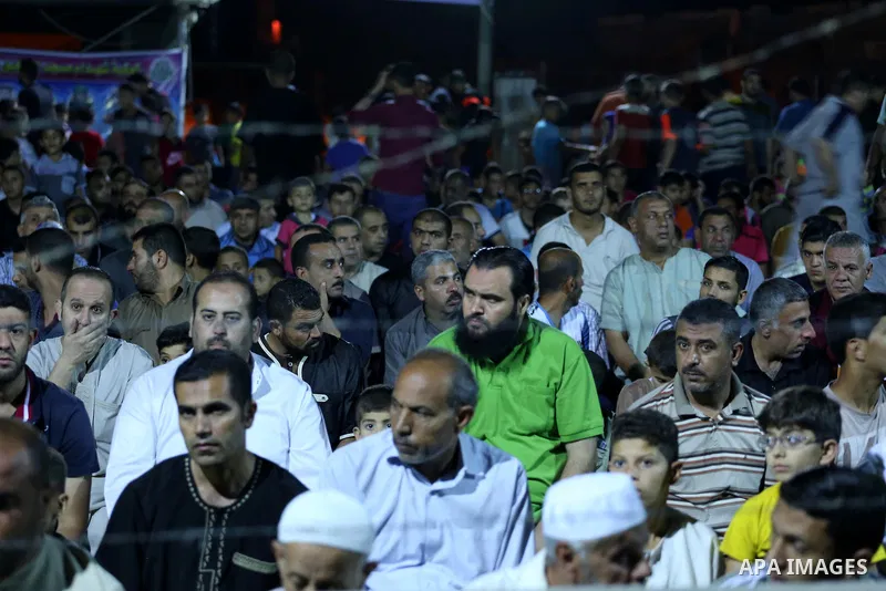 Palestinian Muslim worshipers perform "Taraweeh", nightly prayer of the month of Ramadan, at al-Tawfeq mosque which was destroyed during the 50-day war between Israel and Hamas militants in the summer of 2014, in Shajaiy...