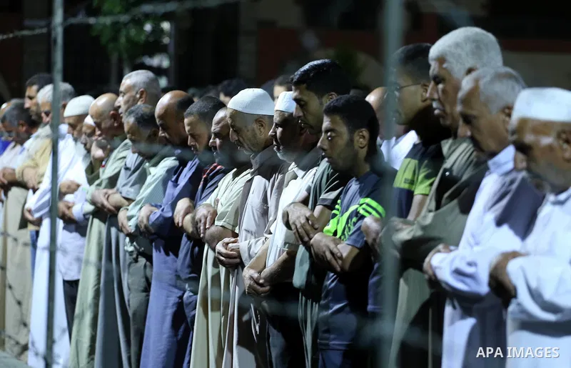Palestinian Muslim worshipers perform "Taraweeh", nightly prayer of the month of Ramadan, at al-Tawfeq mosque which was destroyed during the 50-day war between Israel and Hamas militants in the summer of 2014, in Shajaiy...