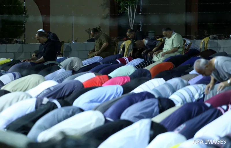 Palestinian Muslim worshipers perform "Taraweeh", nightly prayer of the month of Ramadan, at al-Tawfeq mosque which was destroyed during the 50-day war between Israel and Hamas militants in the summer of 2014, in Shajaiy...