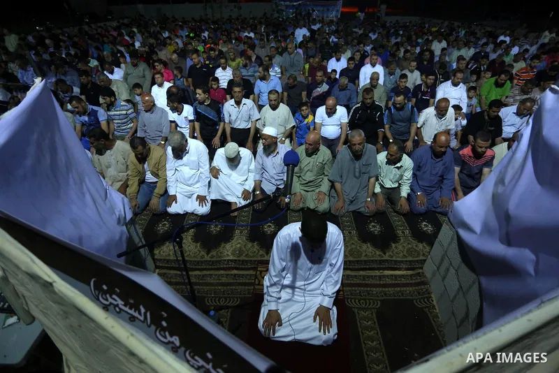Palestinian Muslim worshipers perform "Taraweeh", nightly prayer of the month of Ramadan, at al-Tawfeq mosque which was destroyed during the 50-day war between Israel and Hamas militants in the summer of 2014, in Shajaiy...