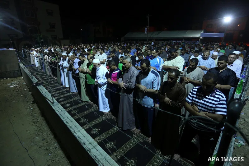 Palestinian Muslim worshipers perform "Taraweeh", nightly prayer of the month of Ramadan, at al-Tawfeq mosque which was destroyed during the 50-day war between Israel and Hamas militants in the summer of 2014, in Shajaiy...