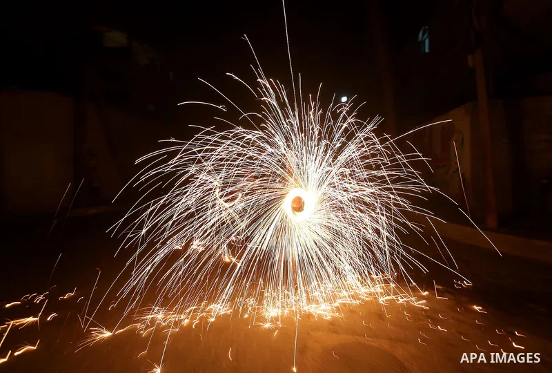 A Palestinian boy plays with fire crackers at street celebrating on the holy month of Ramadan in Gaza city, on June 07, 2016. Ramadan is sacred to Muslims because it is during that month that tradition says the Koran was...