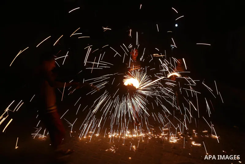 A Palestinian boy plays with fire crackers at street celebrating on the holy month of Ramadan in Gaza city, on June 07, 2016. Ramadan is sacred to Muslims because it is during that month that tradition says the Koran was...