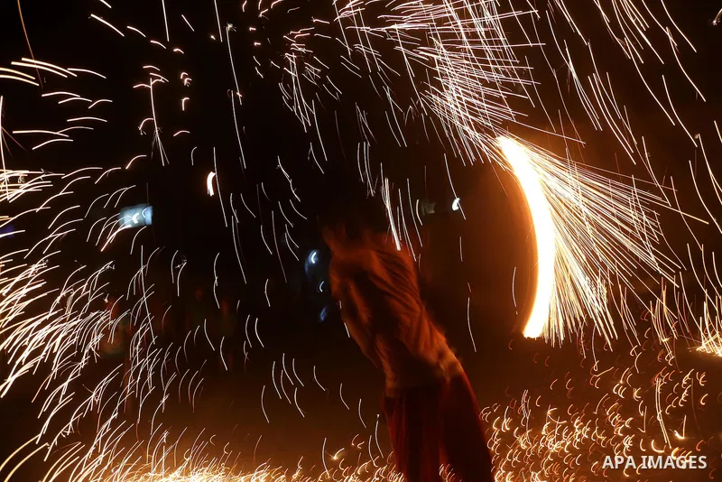 A Palestinian boy plays with fire crackers at street celebrating on the holy month of Ramadan in Gaza city, on June 07, 2016. Ramadan is sacred to Muslims because it is during that month that tradition says the Koran was...