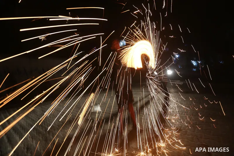 A Palestinian boy plays with fire crackers at street celebrating on the holy month of Ramadan in Gaza city, on June 07, 2016. Ramadan is sacred to Muslims because it is during that month that tradition says the Koran was...