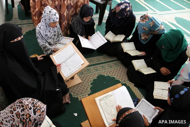 Palestinian girls attend a Quran lesson on the holy month of Ramadan at al-Abrar mosque in Rafah, southern Gaza Strip, on June 07, 2016. Ramadan is sacred to Muslims because it is during that month that tradition says th...