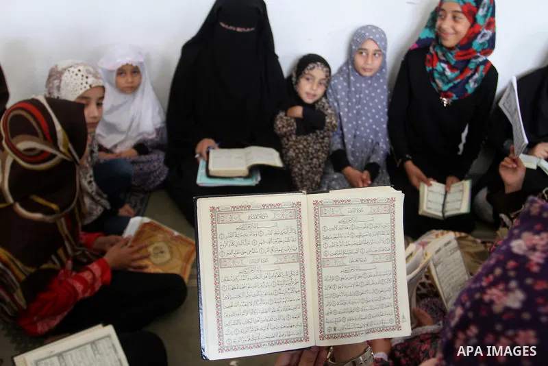 Palestinian girls attend a Quran lesson on the holy month of Ramadan at al-Abrar mosque in Rafah, southern Gaza Strip, on June 07, 2016. Ramadan is sacred to Muslims because it is during that month that tradition says th...