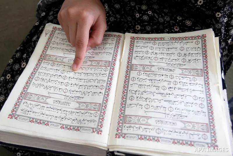 A Palestinian girl attends a Quran lesson on the holy month of Ramadan at al-Abrar mosque in Rafah, southern Gaza Strip, on June 07, 2016. Ramadan is sacred to Muslims because it is during that month that tradition says...
