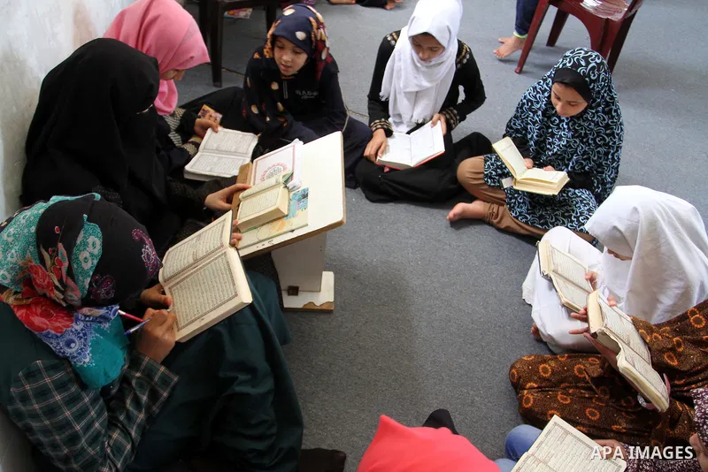 Palestinian girls attend a Quran lesson on the holy month of Ramadan at al-Abrar mosque in Rafah, southern Gaza Strip, on June 07, 2016. Ramadan is sacred to Muslims because it is during that month that tradition says th...