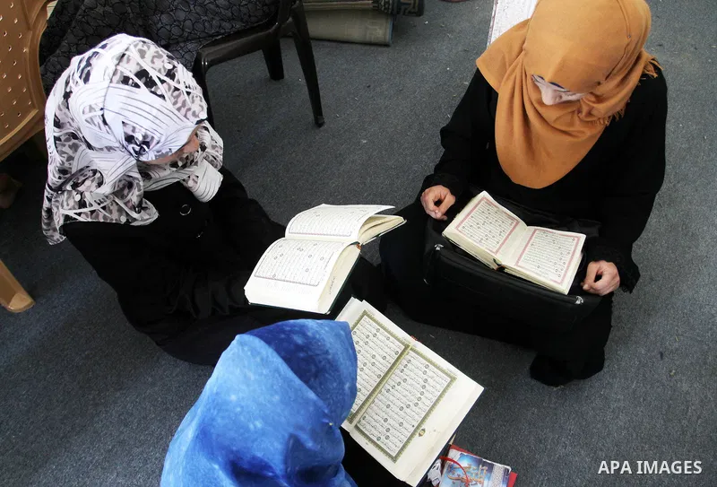 Palestinian girls attend a Quran lesson on the holy month of Ramadan at al-Abrar mosque in Rafah, southern Gaza Strip, on June 07, 2016. Ramadan is sacred to Muslims because it is during that month that tradition says th...
