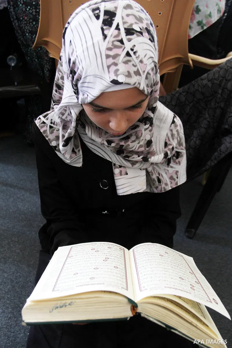 A Palestinian girl attends a Quran lesson on the holy month of Ramadan at al-Abrar mosque in Rafah, southern Gaza Strip, on June 07, 2016. Ramadan is sacred to Muslims because it is during that month that tradition says...