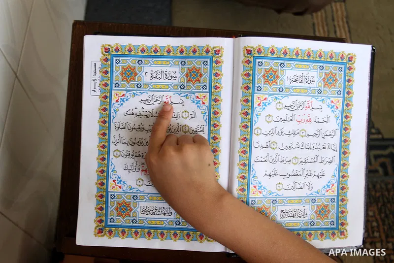 A Palestinian boy attends a Quran lesson on the holy month of Ramadan at al-Abrar mosque in Rafah, southern Gaza Strip, on June 07, 2016. Ramadan is sacred to Muslims because it is during that month that tradition says t...