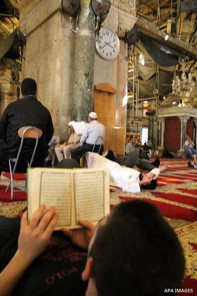 Palestinians Muslims read holy Koran, Islam's holy book, at al-Aqsa mosque, in Jerusalem's old city on June 7, 2016. Ramadan is sacred to Muslims because it is during that month that tradition says the Koran was revealed...