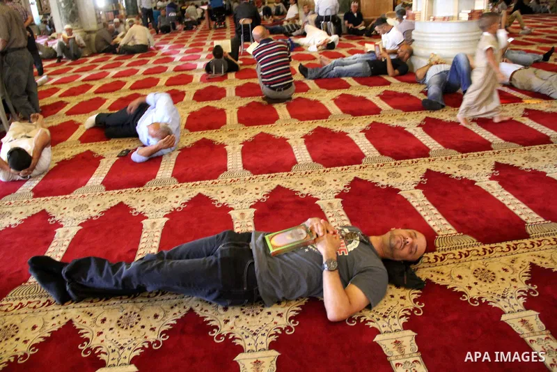 Palestinians Muslims read holy Koran, Islam's holy book, at al-Aqsa mosque, in Jerusalem's old city on June 7, 2016. Ramadan is sacred to Muslims because it is during that month that tradition says the Koran was revealed...