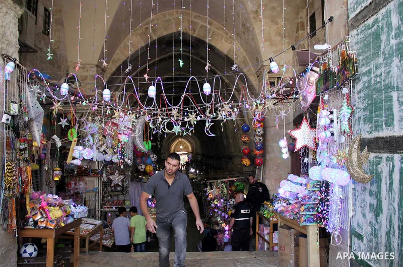 A Palestinian vendor displays traditional lanterns known in Arabic as "Fanous" at a market in Jerusalem's old city on June 7, 2016. Ramadan is sacred to Muslims because it is during that month that tradition says the Kor...