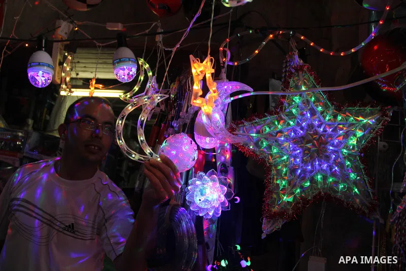 A Palestinian vendor displays traditional lanterns known in Arabic as "Fanous" at a market in Jerusalem's old city on June 7, 2016. Ramadan is sacred to Muslims because it is during that month that tradition says the Kor...