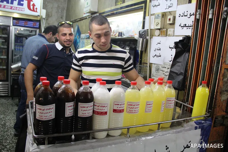 Palestinians shop at a market on the second day of the Ramadan in Jerusalem's old city on June 7, 2016. Ramadan is sacred to Muslims because it is during that month that tradition says the Koran was revealed to the Proph...